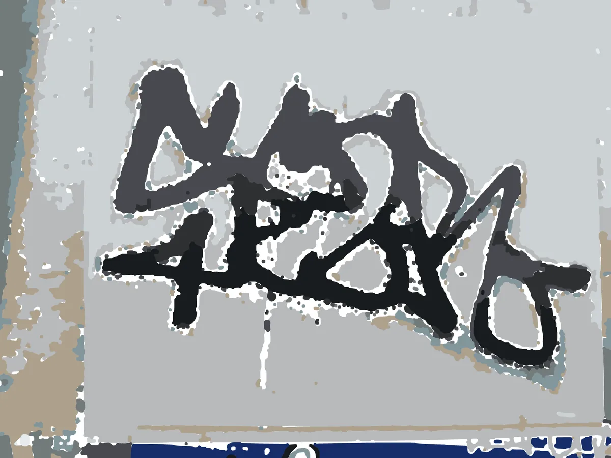 Layered cut file traced from a photo of a black-ink sticker tag, the ink reduced to flat colour layers.